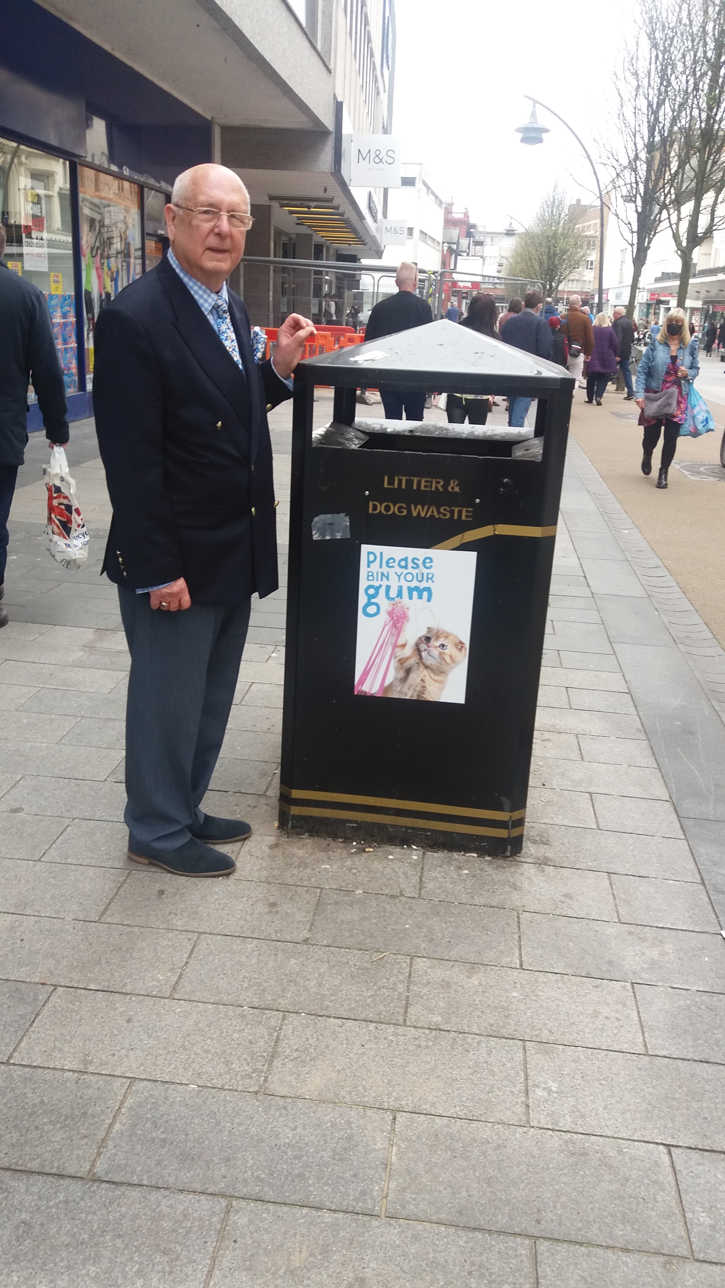 Photograph shows Sir Ron indicating where public refuse bins on Chapel Street do need much more prominent signage.